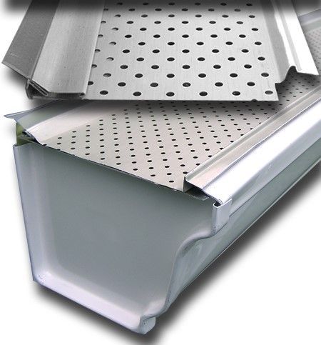 A close up of a metal gutter with holes in it