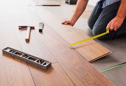 Man installing new hardwood floor