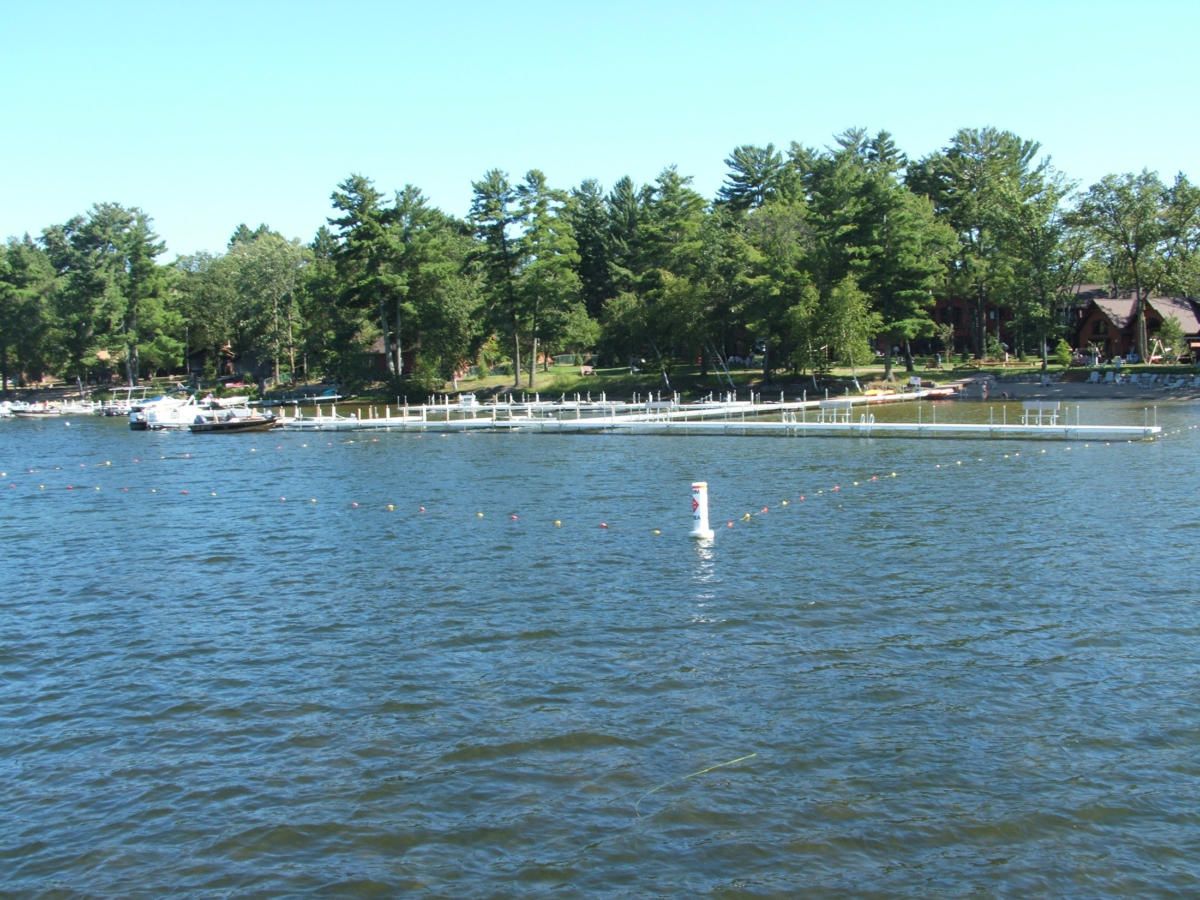 A large body of water with trees in the background