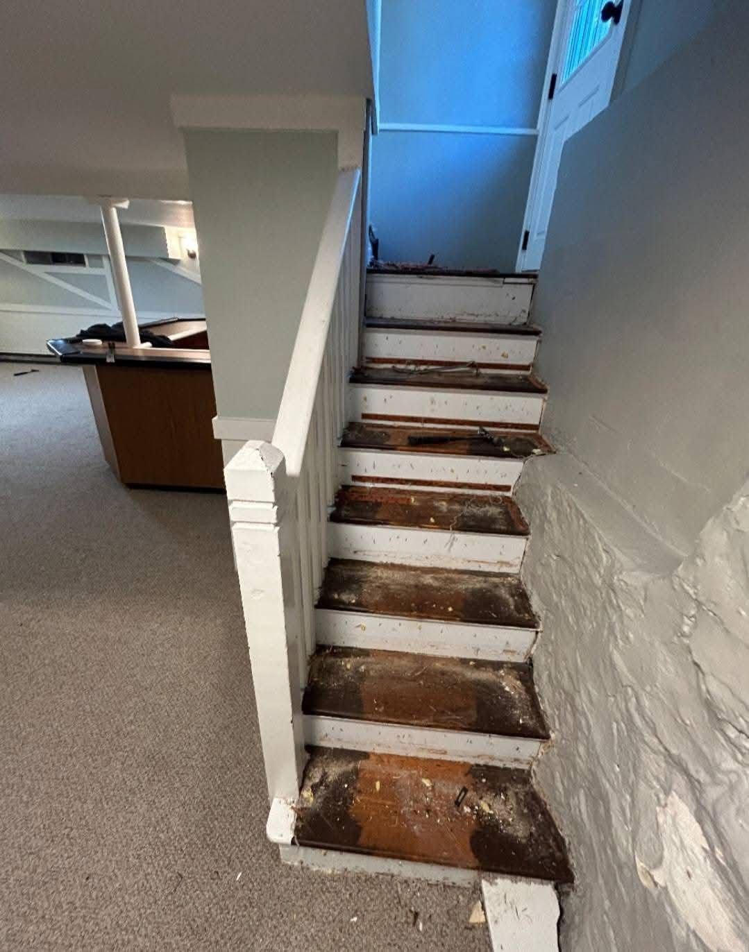 A set of stairs leading up to the second floor of a house.