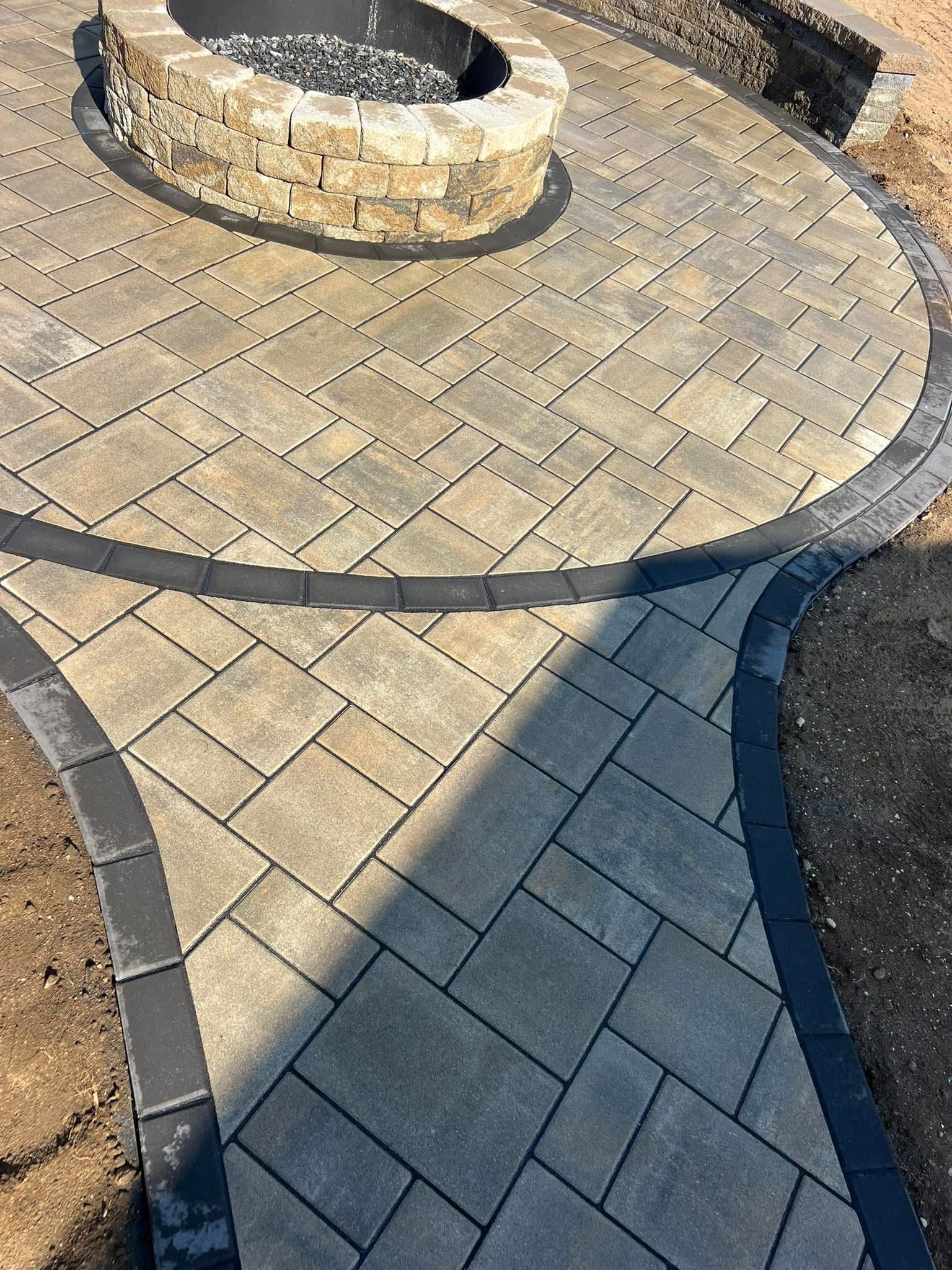 There is a fire pit in the middle of the patio.