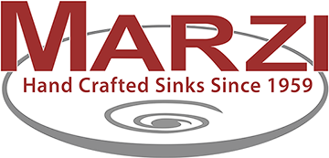 Logo for Marzi Hand Crafted Sinks, with text and a swirl design on a gray oval.