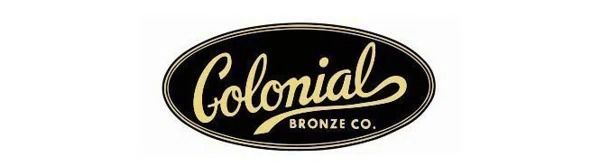 Colonial Bronze Co. logo: Gold script on black oval.