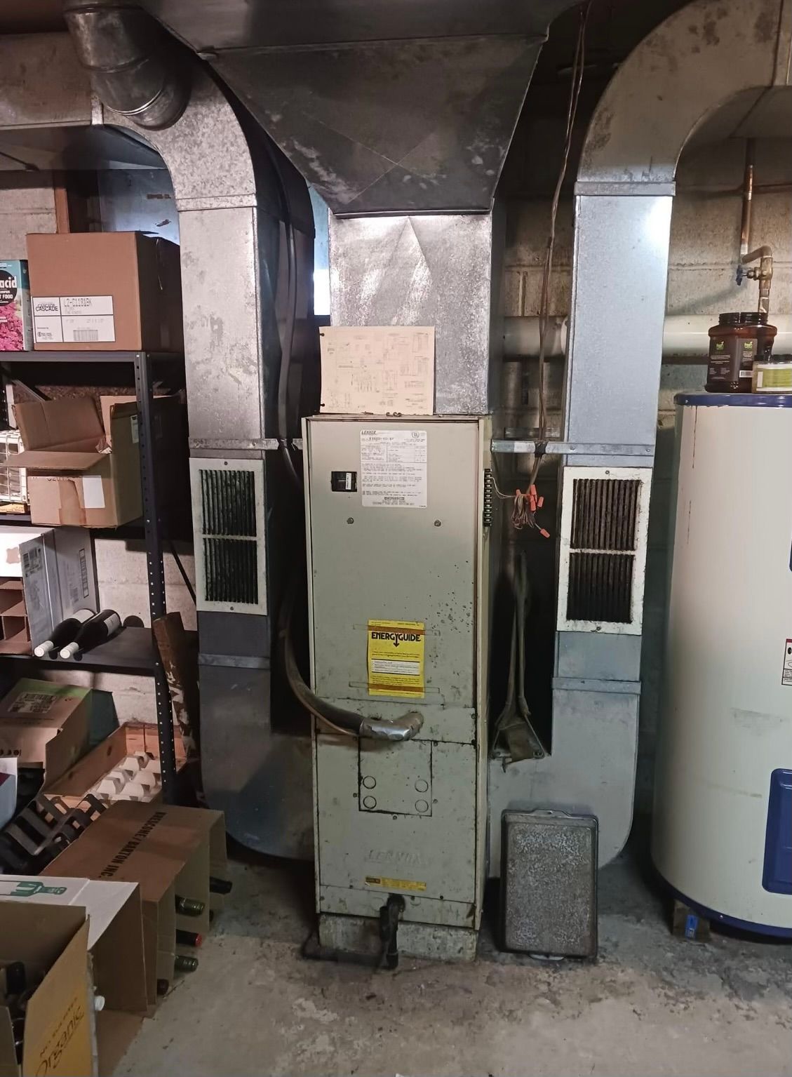 A room with a heater and a water heater in it