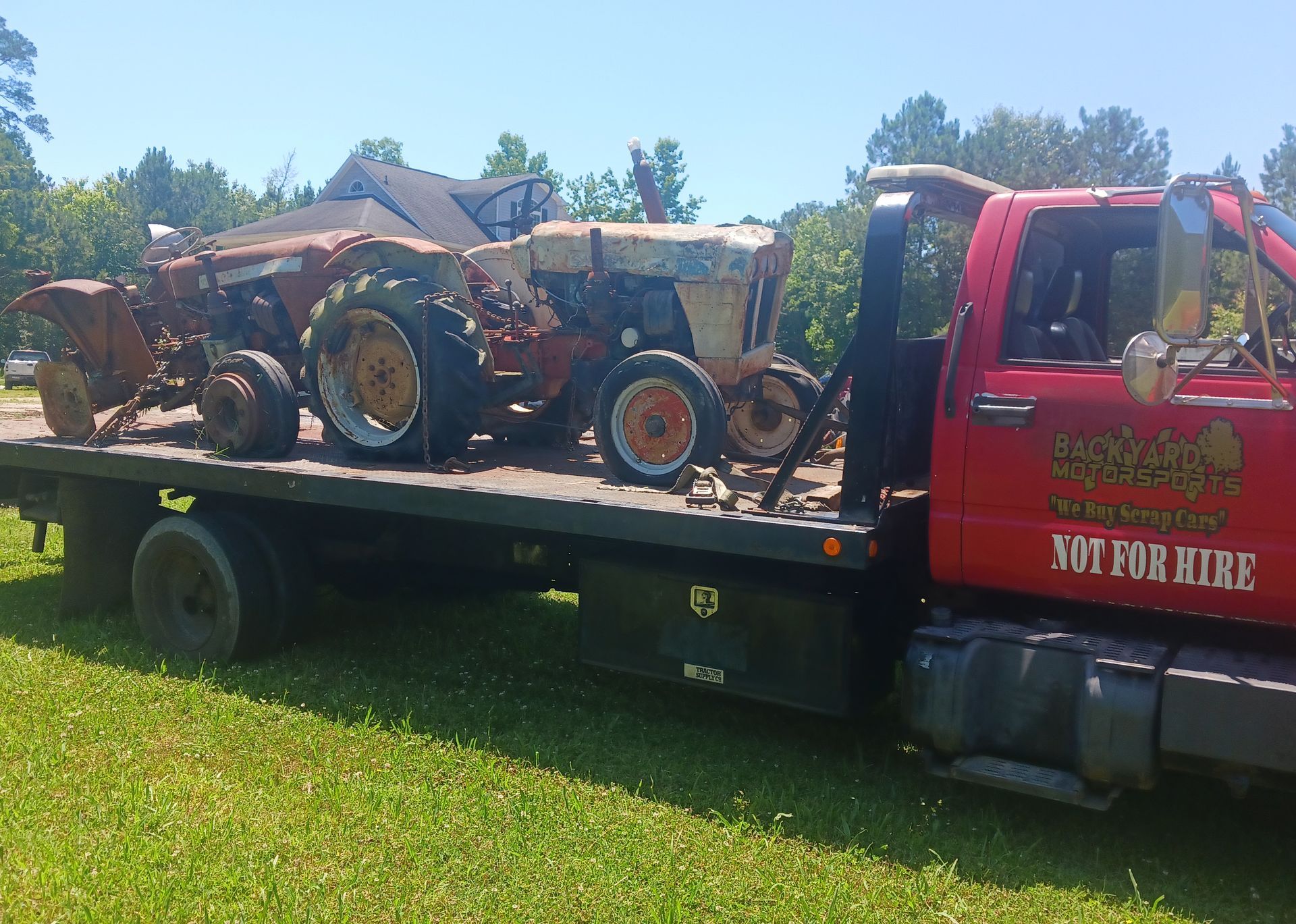 A red tow truck with the word not for hire on it