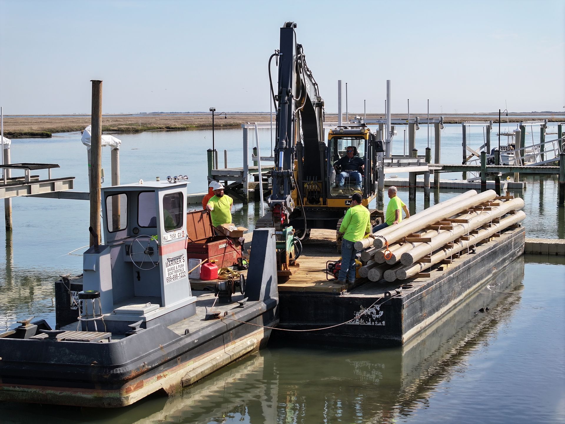 Two boats are docked next to each other in the water.