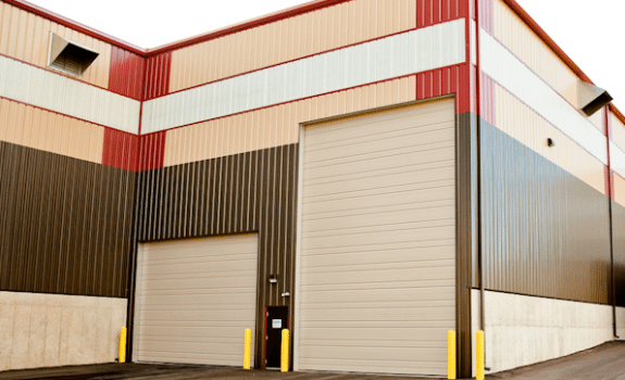 A large building with a lot of doors on it