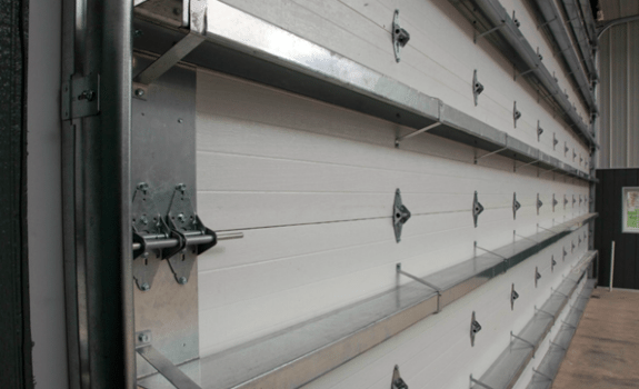 A close up of a garage door with a lot of latches on it.