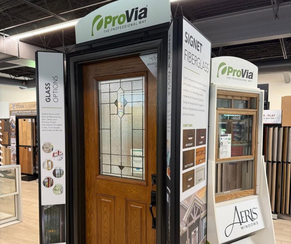 ProVia front door display with wood door and decorative glass at a showroom booth