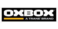 OXBOX logo on black with yellow stripe and “A Trane Brand” text