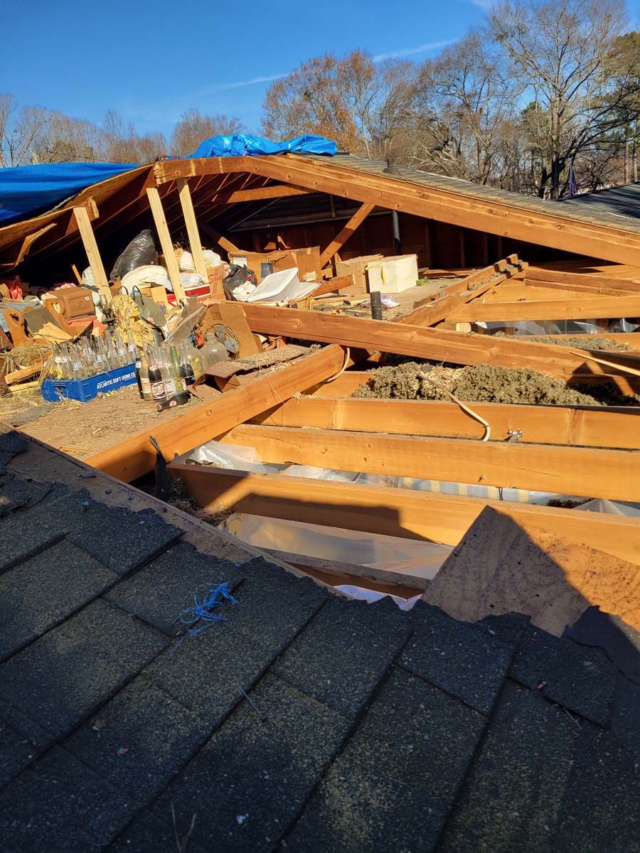 The roof of a house is being demolished.