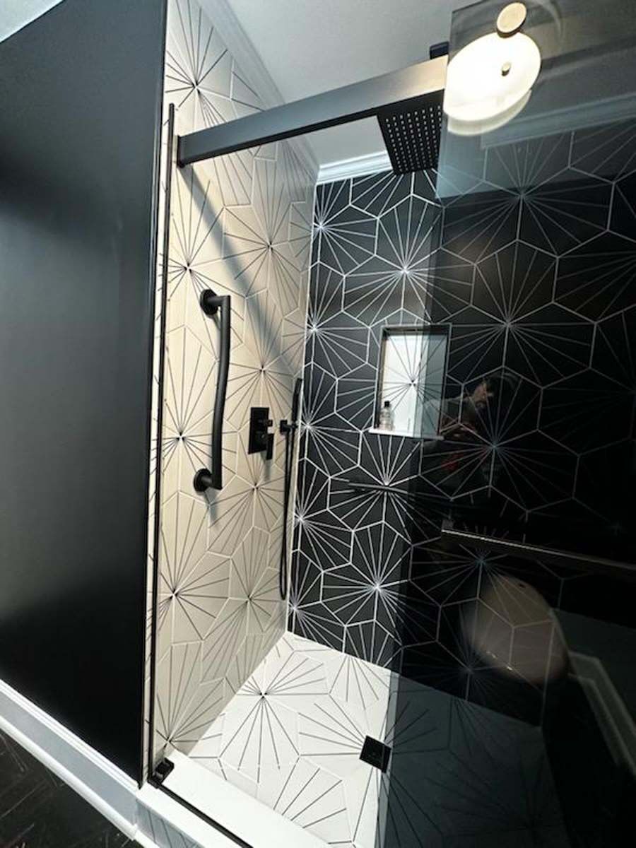 A bathroom with a walk in shower and a toilet.