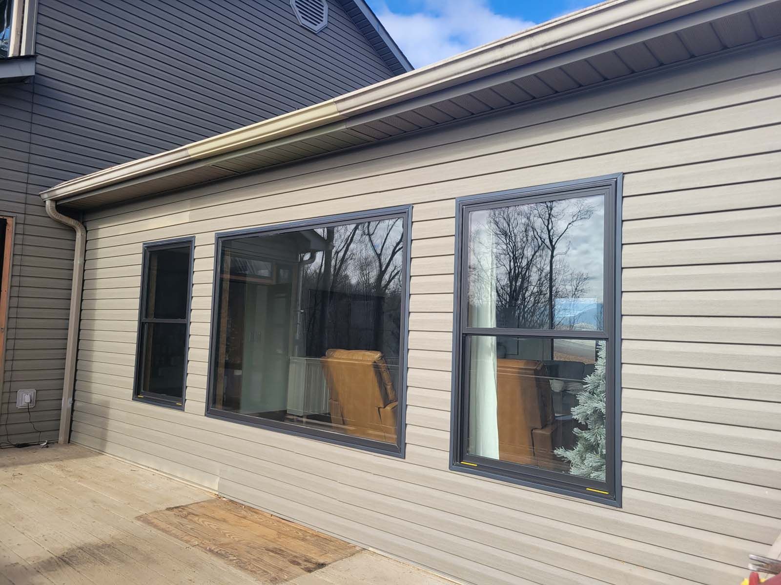 A house with a lot of windows on the side of it.