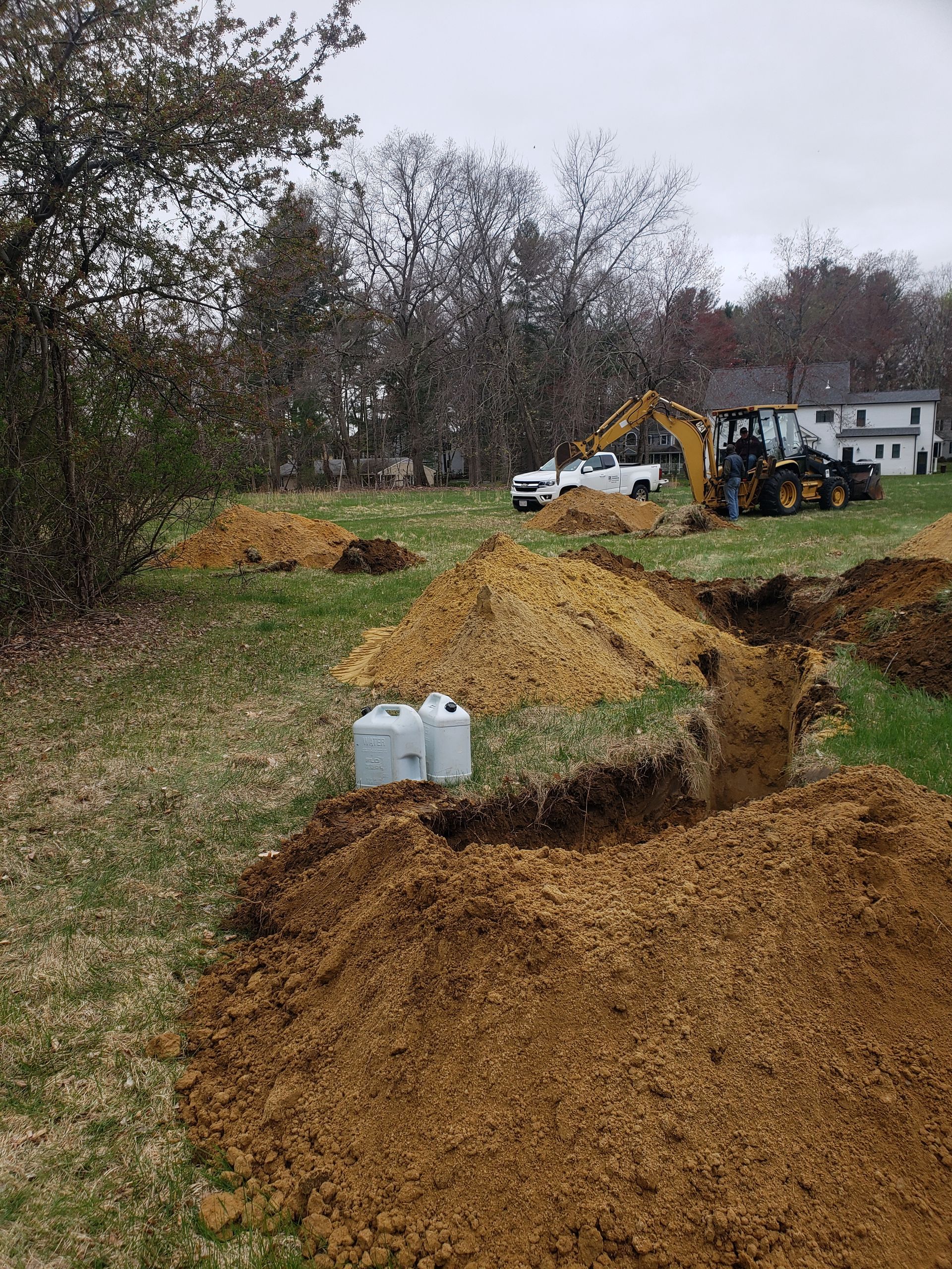 a large pile of dirt is sitting in the middle of a field