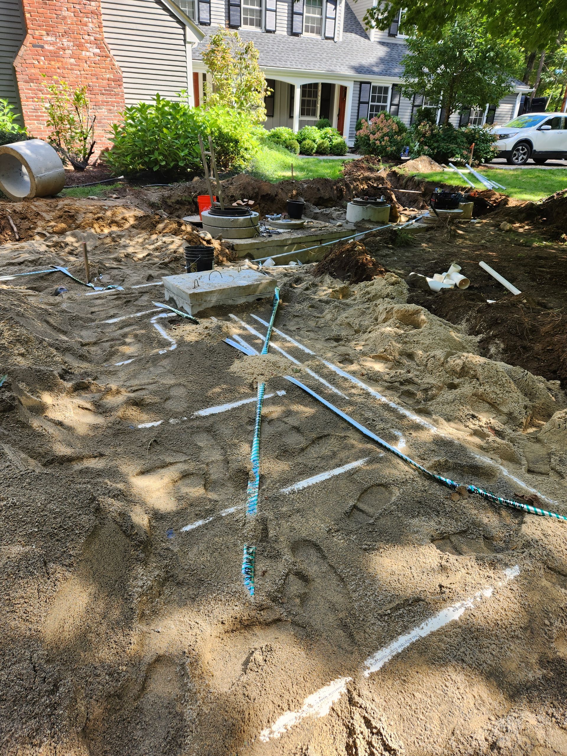 a large pile of dirt is sitting in front of a house