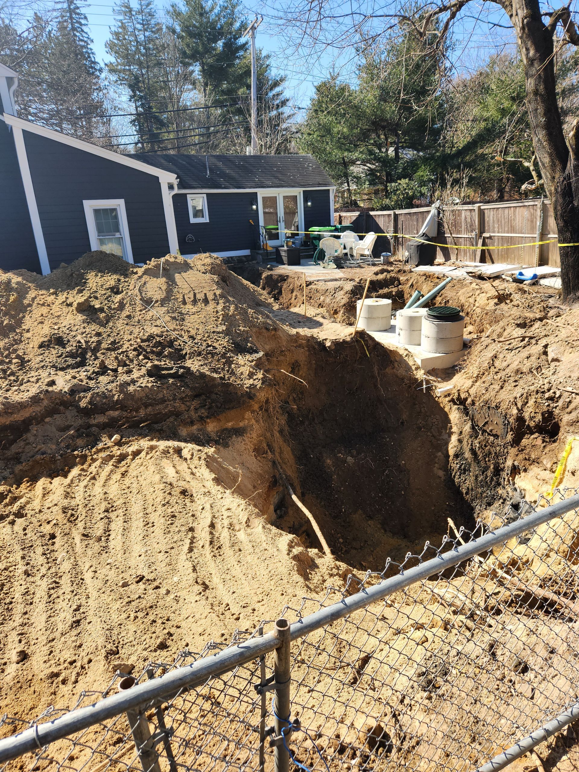 a large pile of dirt is sitting in front of a house
