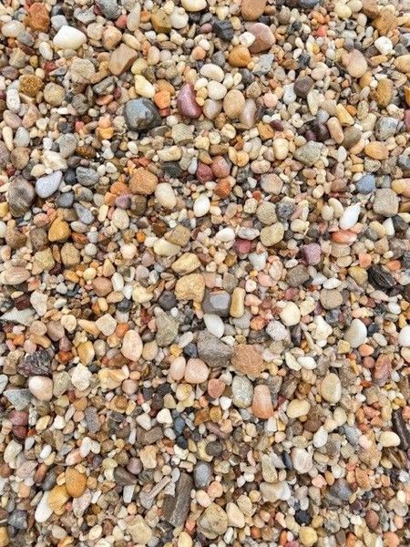 Close-up of multicolored pebbles and gravel covering the ground