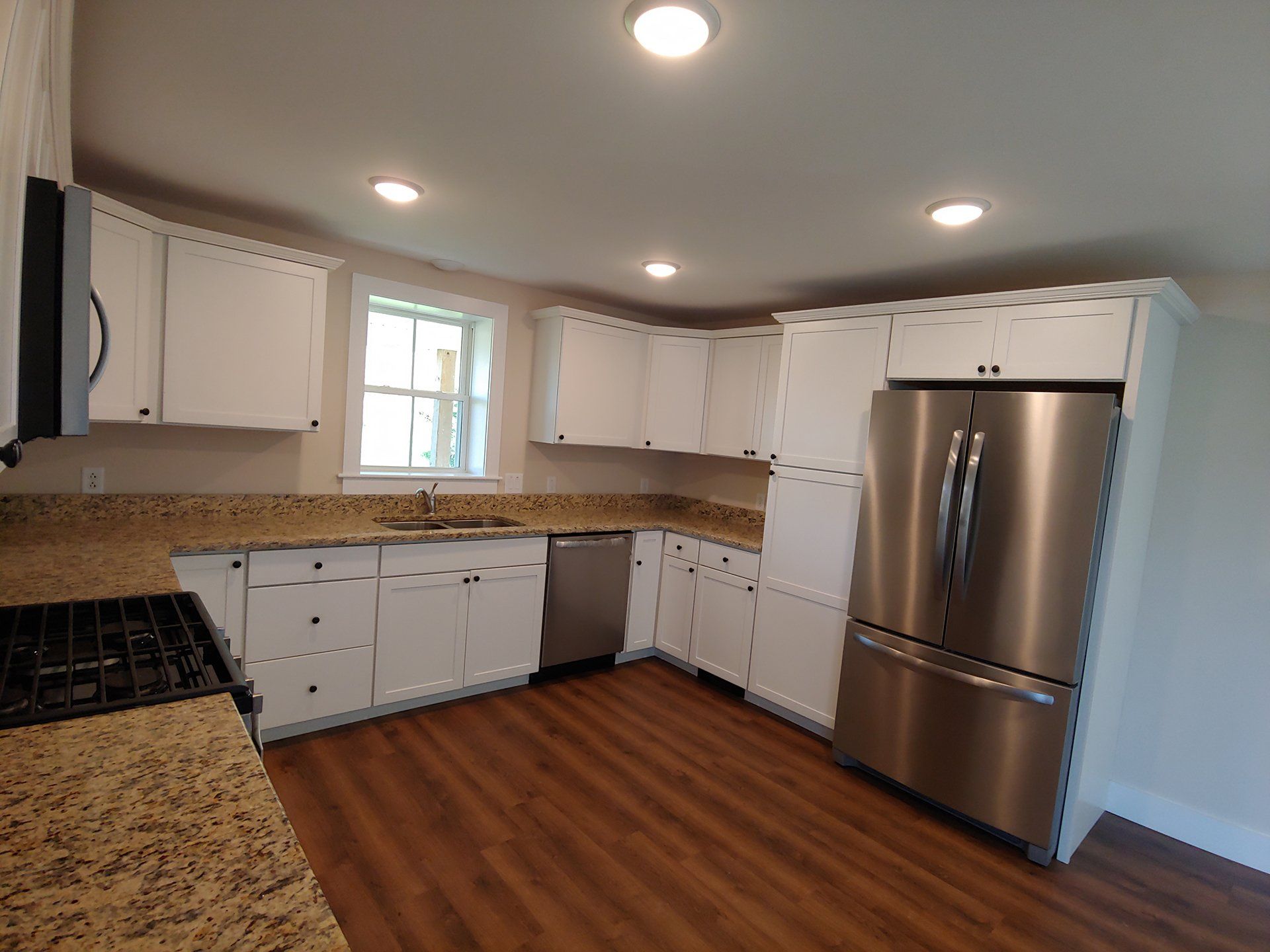 Kitchen with fridge and sink