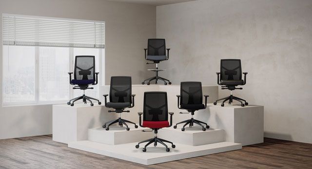 Office chairs on white platforms; a red-backed chair stands out in the center.
