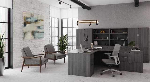 Modern office with desk, two chairs, shelving, and large windows. Gray and neutral tones.