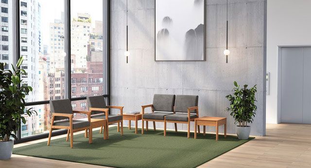 Modern waiting room with wooden furniture, large windows, and an abstract landscape painting.