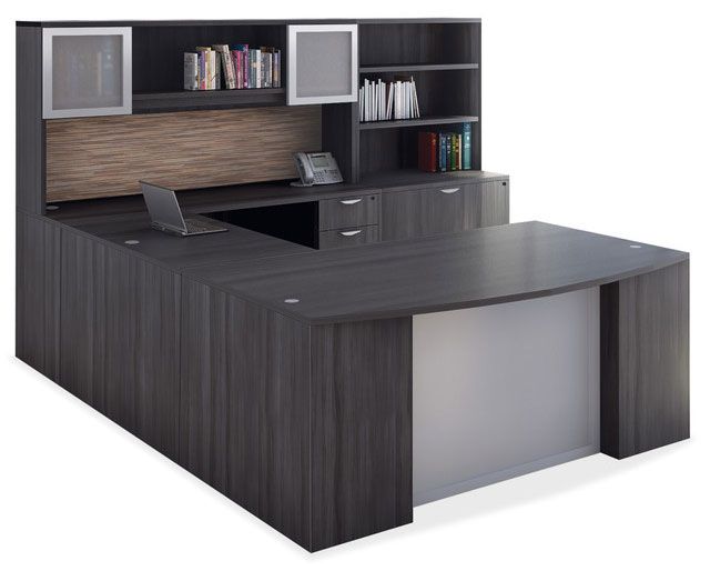 Dark gray U-shaped executive desk with hutch and bookshelves.  Laptop on the desk.