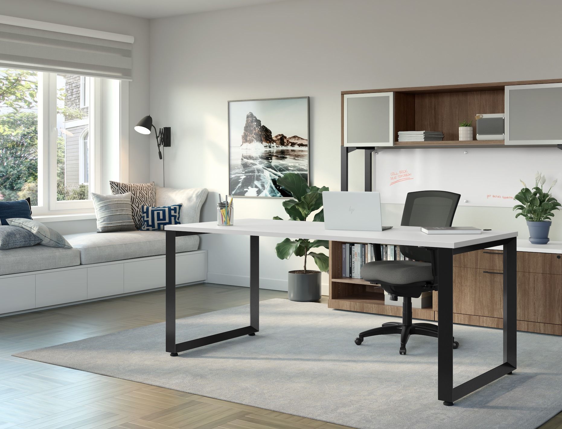 Modern home office with white desk, black chair, and overhead storage.