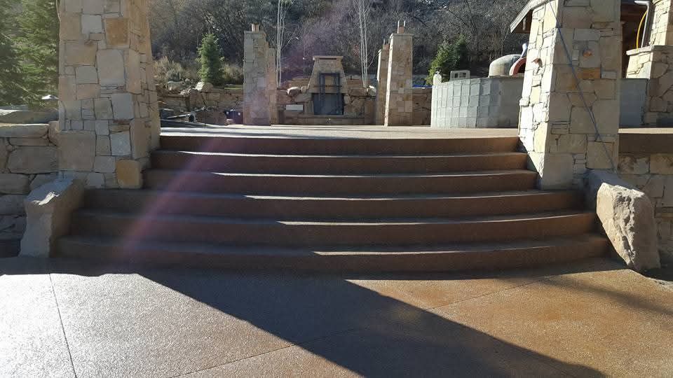 A set of stairs leading up to a stone wall