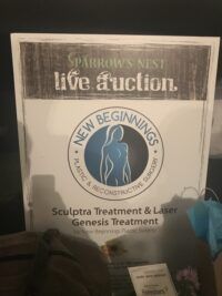 A sign that says ' sparrow 's nest live auction ' on it