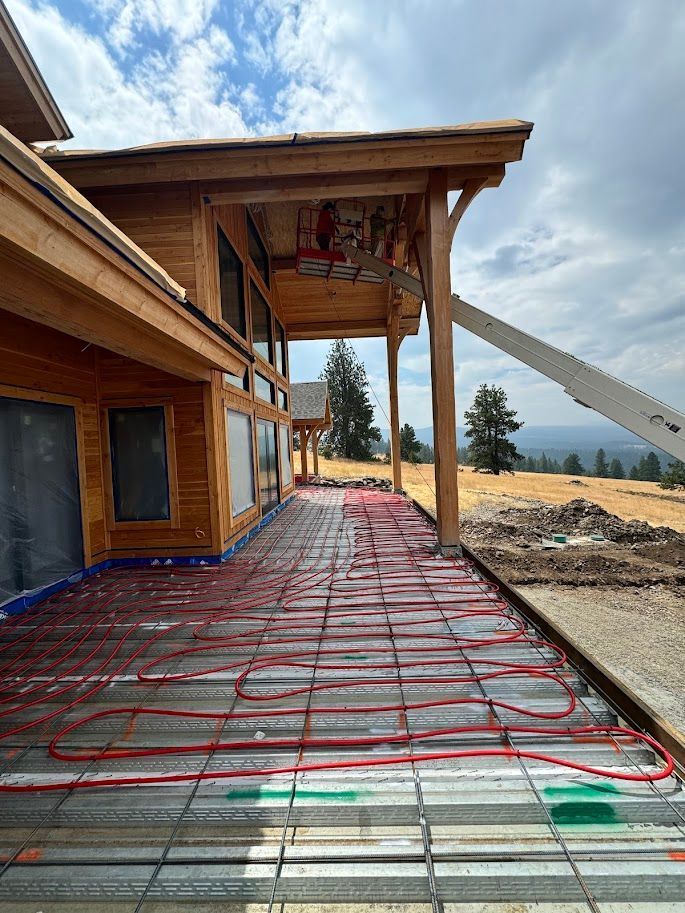 A snowmelt system is being installed for the walkway surrounding the house.