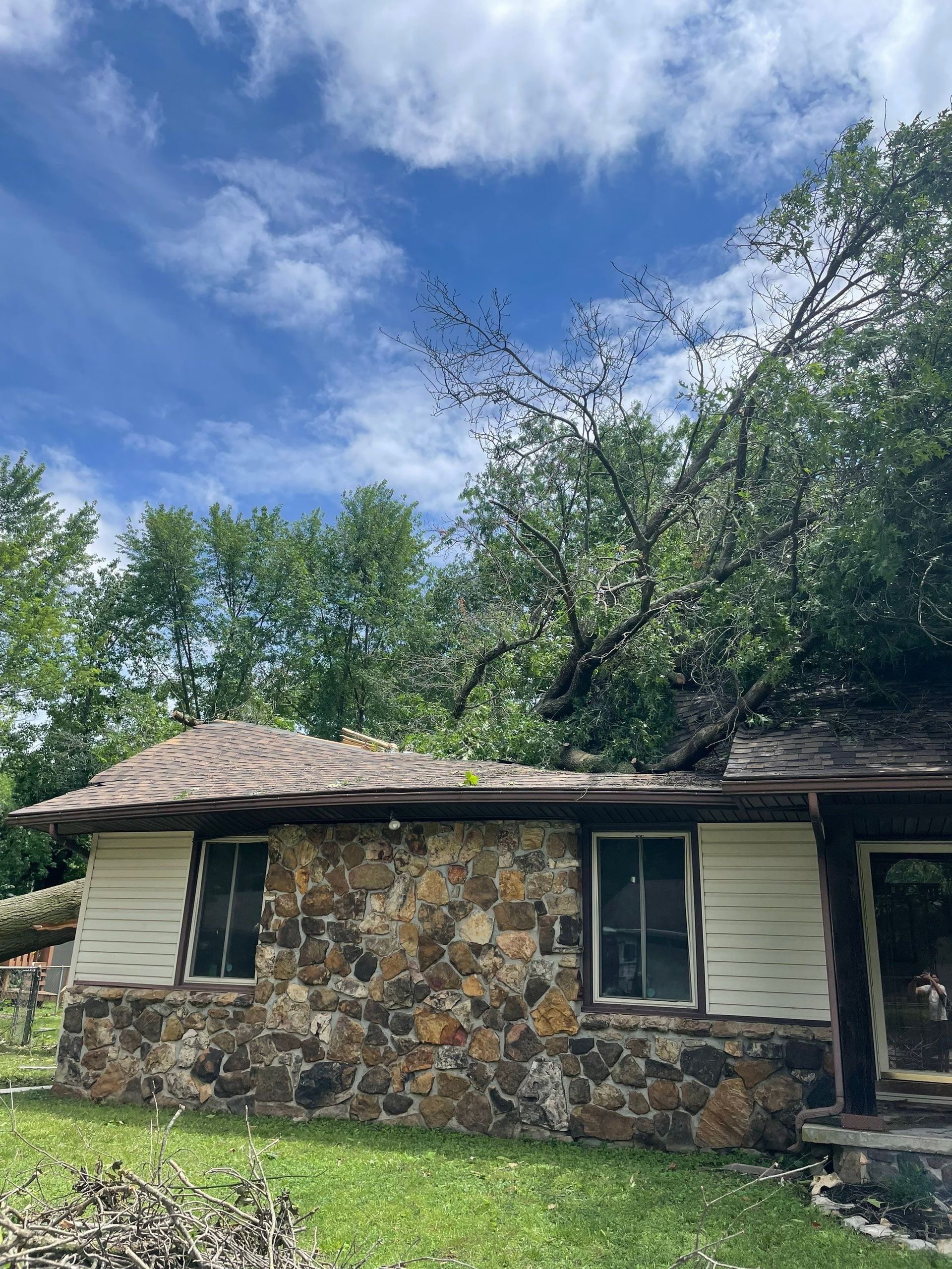 storm-damaged home in Southwest Missouri with roof and water damage after severe weather