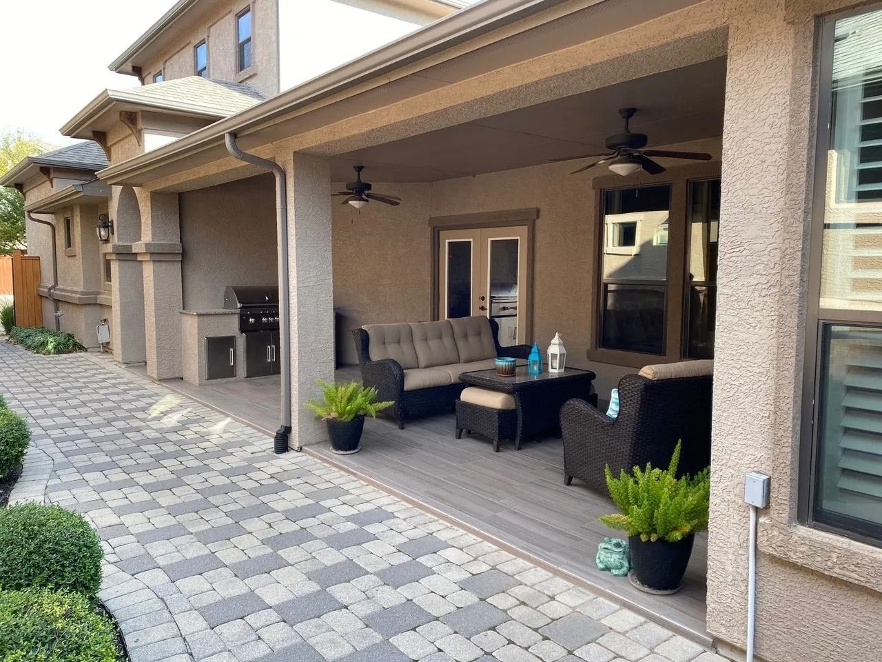 A patio with furniture and a ceiling fan