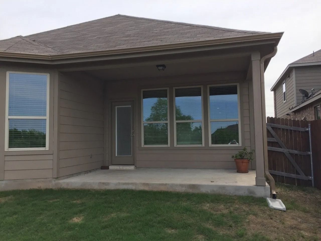 A house with a porch and a lot of windows