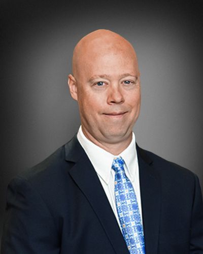 Attorney Patrick M. Bertrandt wearing a suit and tie