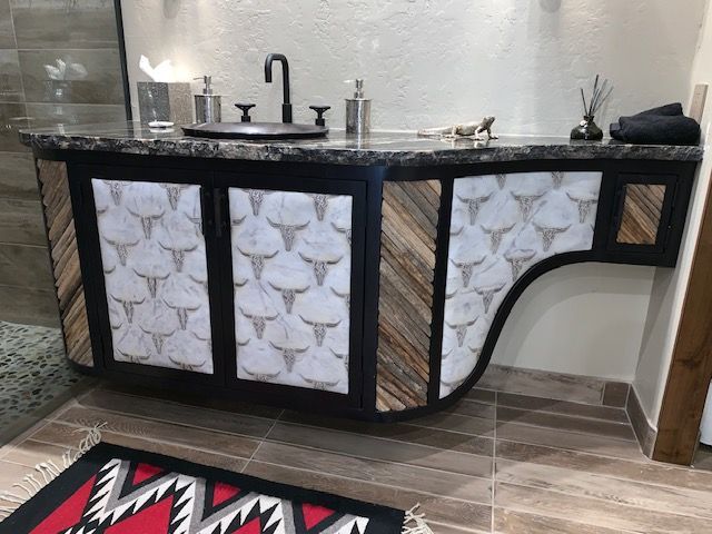 A bathroom sink featuring a sleek cabinet design