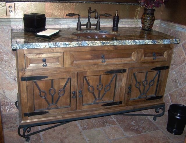 A bathroom vanity with a sink, a mirror, and a sleek cabinet design