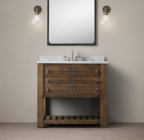 A bathroom features a vanity with wooden cabinet and a mirror