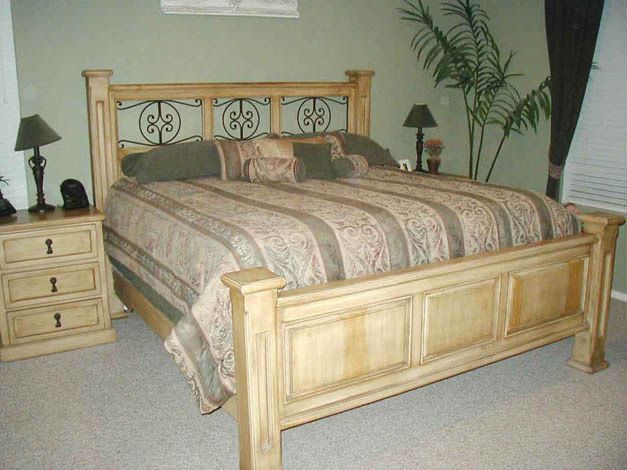 A bedroom with a king size bed and two nightstands
