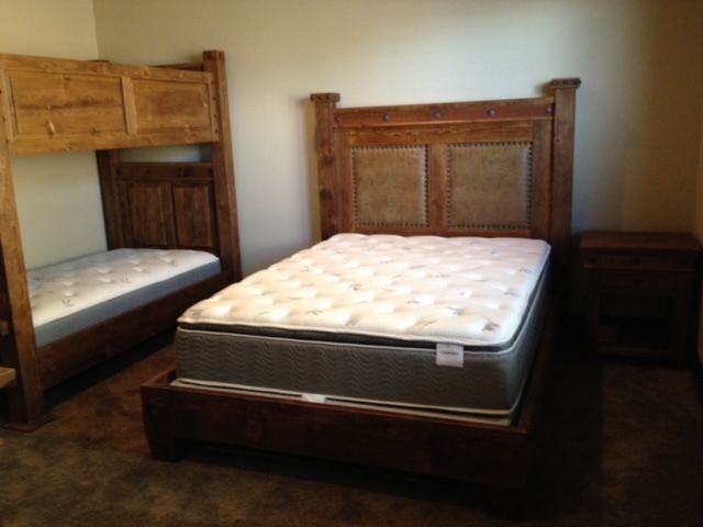 A bedroom with a bunk bed and a mattress