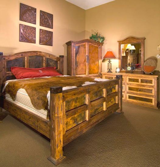 A bedroom with a bed dresser and mirror