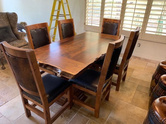 A wooden dining table and chairs in a living room