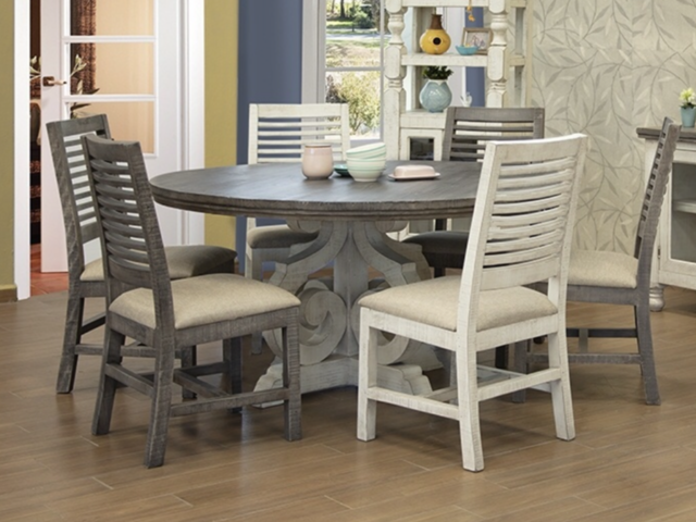 A dining room with a table and chairs in it