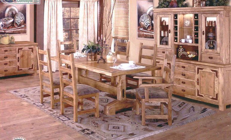 A dining room with a wooden table and chairs