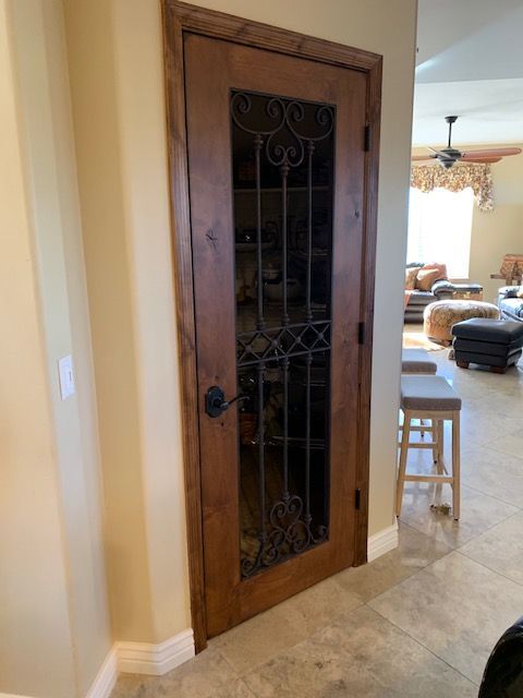 A wooden door with a glass window in a living room