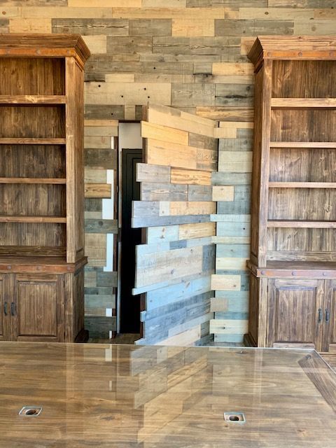 A room with wooden shelves and a wooden wall