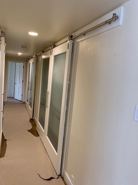 A long hallway with sliding glass doors
