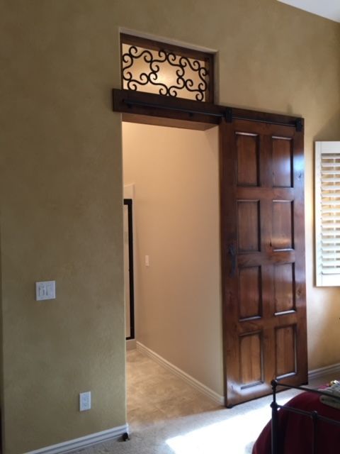 A bedroom with a sliding door and a window