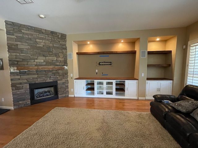 A living room with a fireplace and a couch