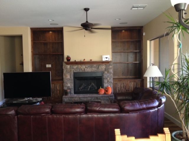 A living room with a fireplace and a couch