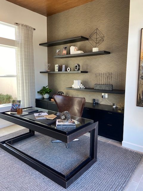 A home office with a desk and a chair